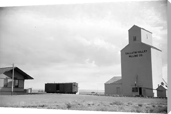 GRAIN ELEVATOR, 1939. A grain elevator at a railroad station in Fairfield, Montana