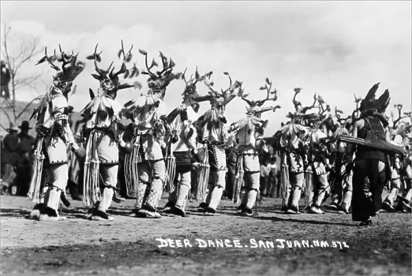 NEW MEXICO: DEER DANCE. Costumed participants in a deer dance, San Juan County, New Mexico