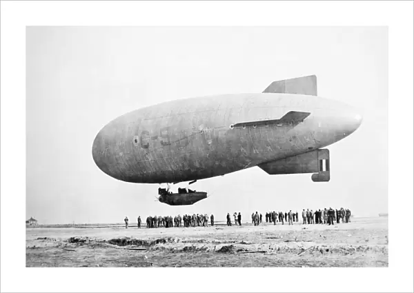 AIRSHIP. An airship flying over an airfield
