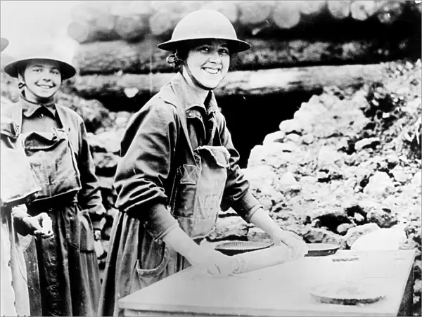 SALVATION ARMY, c1920. Salvation Army at the front. Two women of the Salvation Army baking pies in a trench. Photograph, c1920