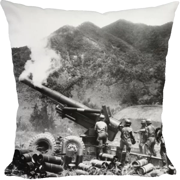 KOREAN WAR: ARTILLERY. U. S. artillerymen firing an 8-inch howitzer on the front in Korea, June 1951