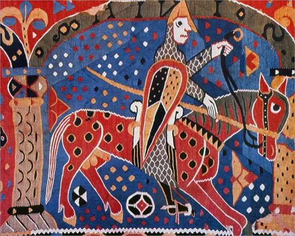 NORSE WARRIOR, 12th CENT. A Norseman going off to war. Detail of a mid 12th century Swedish tapestry