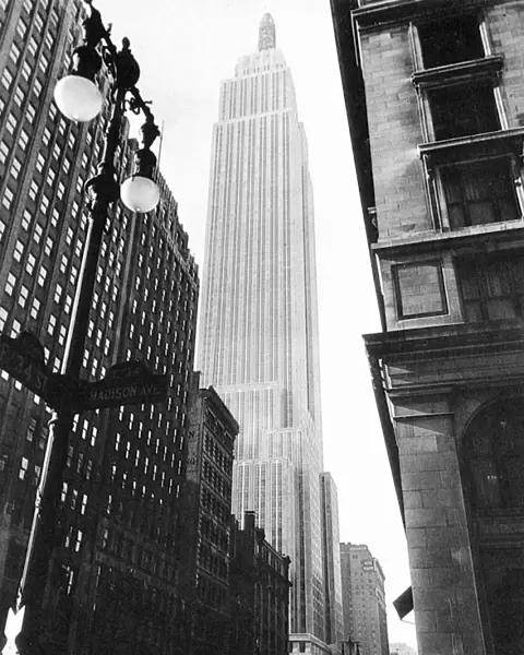 EMPIRE STATE BUILDING, 1931. Photographed from the corner of East 34th Street and Madison Avenue by Lewis Hine, soon after its completion in May 1931