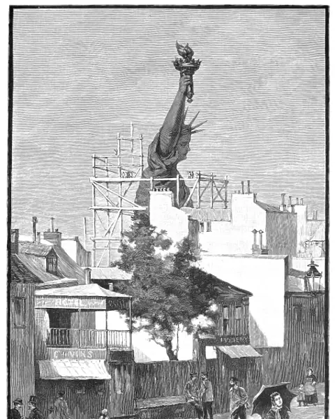 STATUE OF LIBERTY, 1884. Beginning the work of removing the Statue of Liberty from its construction site in Paris, France. Wood engraving, American, 1884