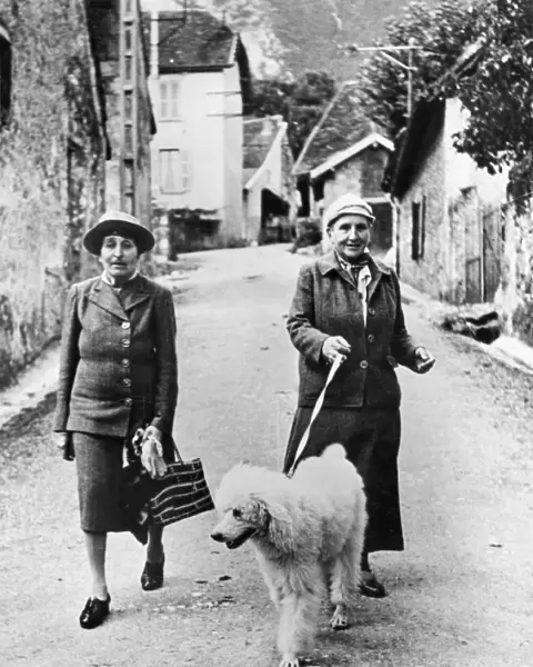STEIN AND TOKLAS, 1944. American writer Gertrude Stein (1874-1946) photographed in southeastern France in September 1944 with her companion, Alice B. Toklas (left)