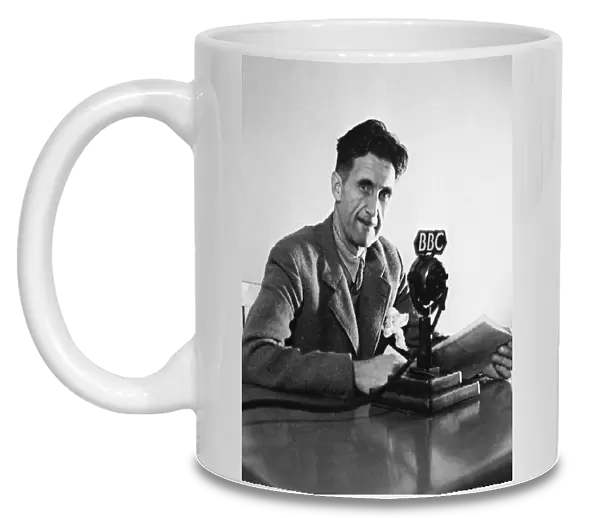 GEORGE ORWELL (1903-1950). Pseudonym of Eric Blair. English novelist and essayist. Orwell broadcasting over the BBC in London, England, in 1943