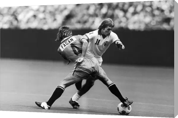 STEPHEN HUNT (1956- ). English soccer player. Hunt (right) playing for the New York Cosmos, battles Bernie Fagan of the Los Angeles Aztecs during a match, c1977