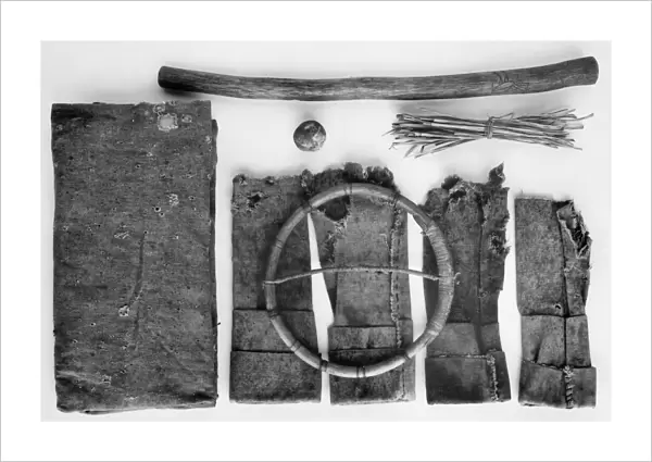 Moccasin game kit, with wooden hoop, stick, ball, and stack of twigs. Chiricahua Apache, from Oklahoma