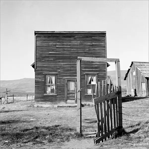 A former saloon and stagecoach tavern converted into the temporary home for a member of the Ola Self-Help Sawmill cooperative in Gem County, Idaho. Photograph by Dorothea Lange, October 1939