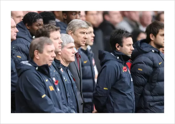 Arsenal manager Arsene Wenger and his staff during