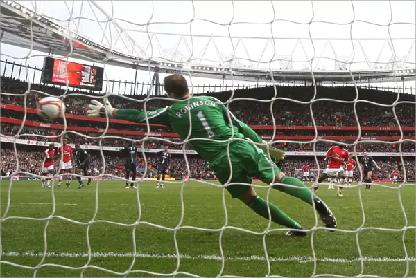 Emmanuel Eboue shoots past Paul Robinson from the penalty