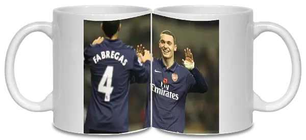 Thomas Vermaelen and Cesc Fabregas celebrate the 4th Arsenal goal