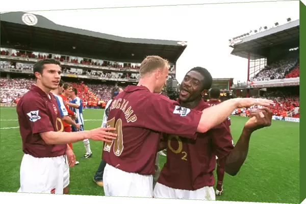 Robin van Persie, Dennis Bergkamp and Kolo Toure celebrate at the end of the match