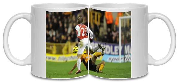 Andrey Arshavin (Arsenal) tackled by Karl Henry (Wolves). Wolverhampton Wanderers 0