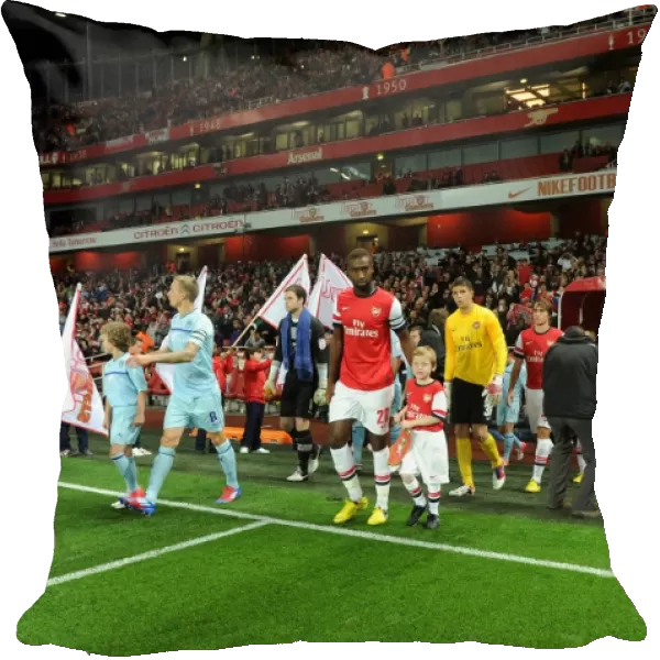 Johan Djourou (Arsenal) with the Arsenal Mascot. Arsenal 6: 1 Coventry City