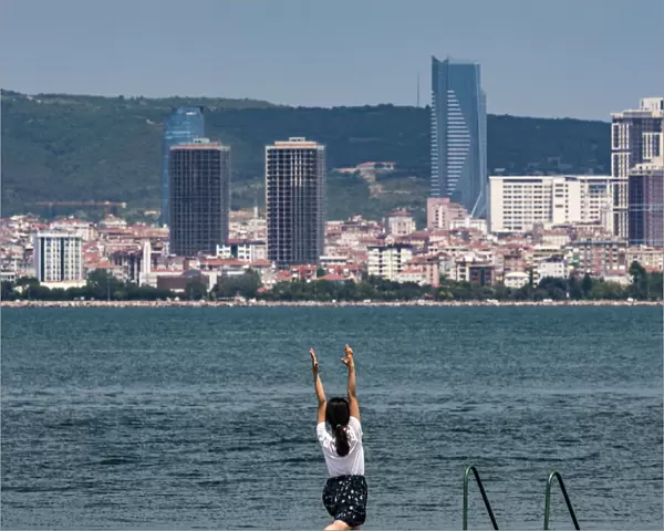 Yoga exercise on the island of Büyükada, one of the Princes` Islands near Istanbul, Turkey