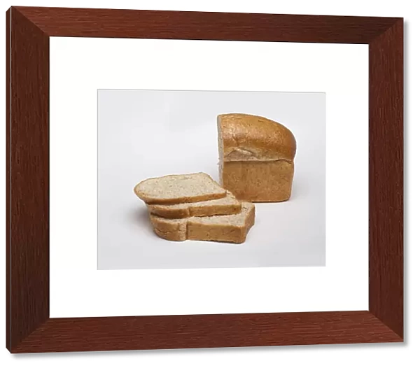 Loaf and slices of whole wheat bread