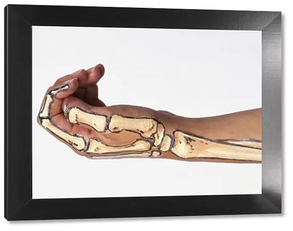 Arm with bone structure painted on skin