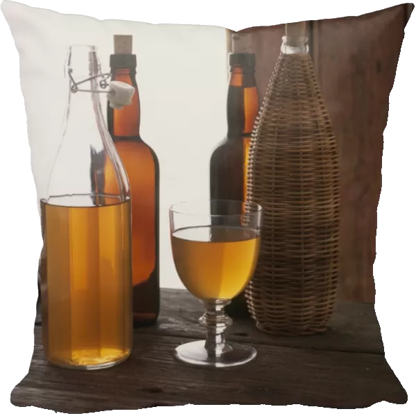 Bottles and glass of home-made cider