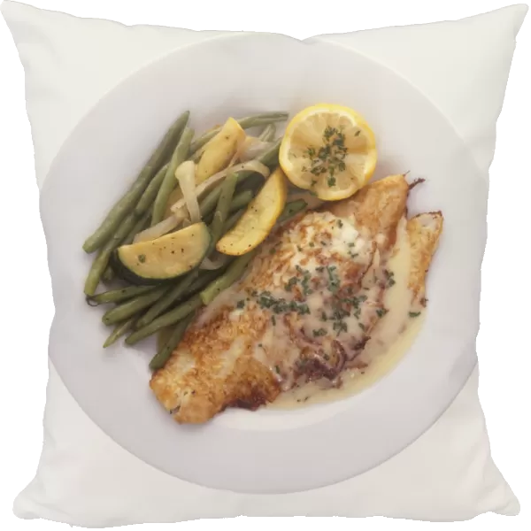 Petrale sole served sauteed with green beans, lemon, herbs and sauce, view from above