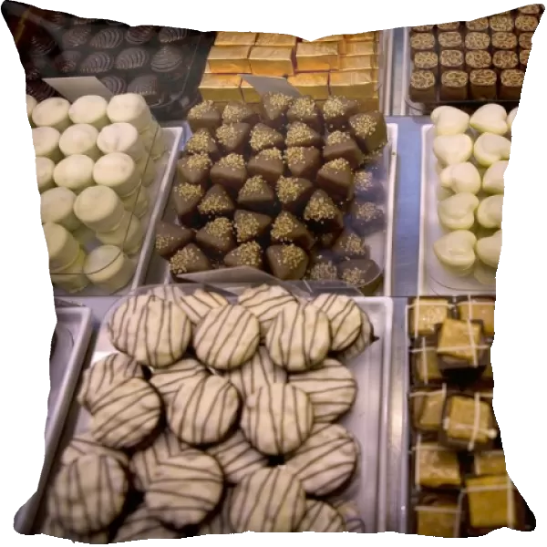 Selection of Belgian confectionery displayed on trays in shop
