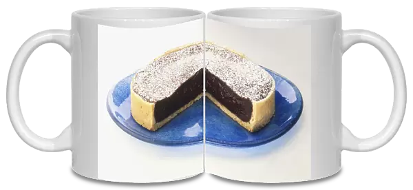 Chocolate tart with removed section, side view
