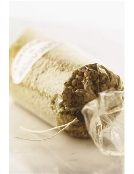 Bag of green lentils tied with a string, close up