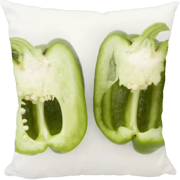 Sliced organic Capsicum annuum (Green Bell Peppers) showing flesh and seeds