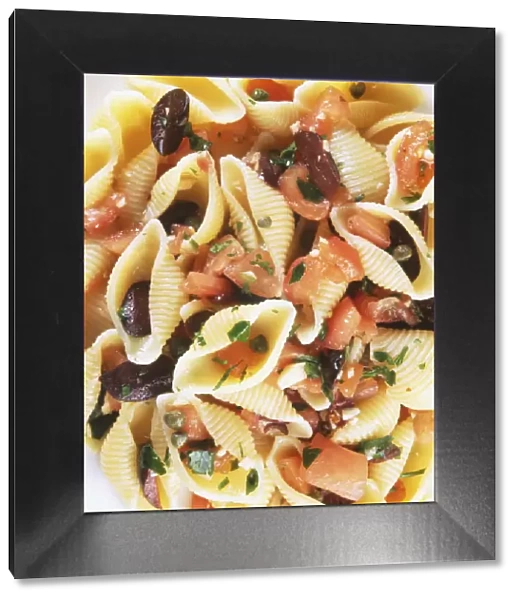 Shell pasta with an olive, caper and tomato sauce