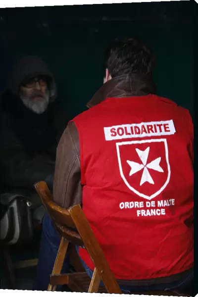 Homeless person with a Malta Order volunteer