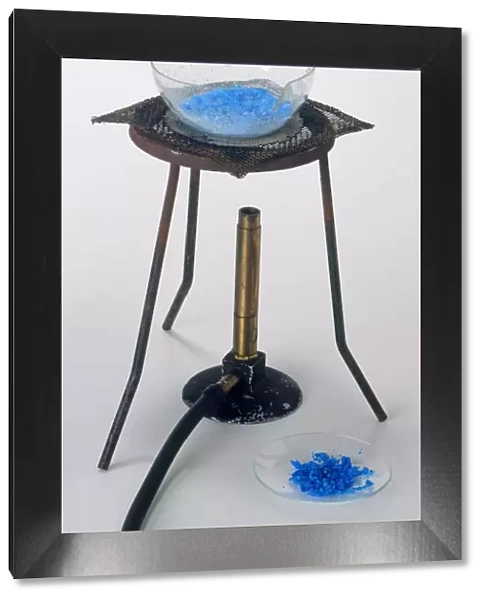 Heating water and copper sulphate solution with bunsen burner, leaving blue copper sulphate crystals