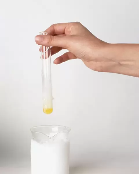 Test tube of chlorine condensed into liquid by dipping into jug of dry ice