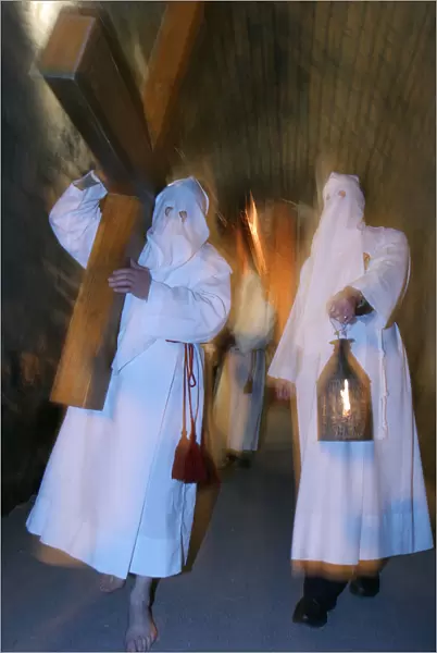 White penitentss Easter week procession in Le Puy en Velay