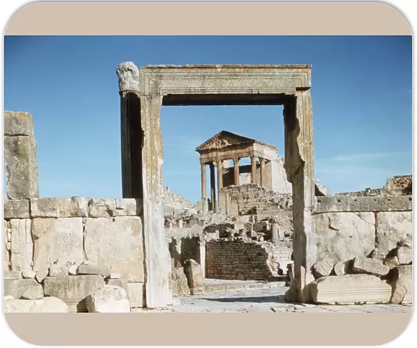 Tunisia, Dougga, Roman ruins of the Capitol viewed through Dar el Acheb portal