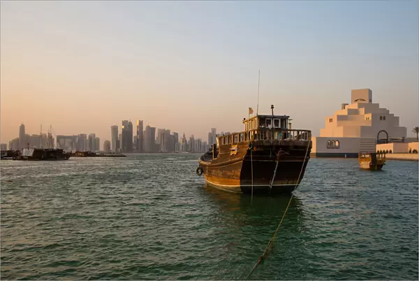 View of Doha Skyline Along Doha Bay With Traditional Dhow in the Foreground and Museum of Islamic Art on the Right, Doha, Qatar