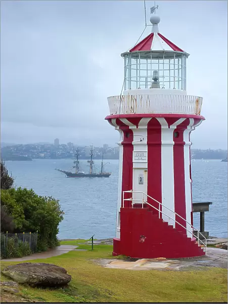 Lighthouse in the harbour with the three-master Bounty, Sydney