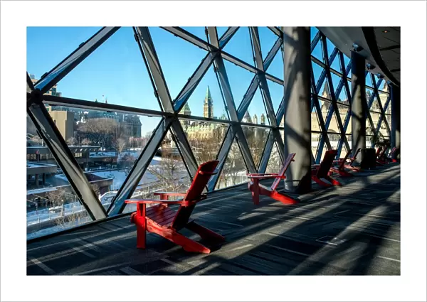 Red chairs overlooking downtown Ottawa