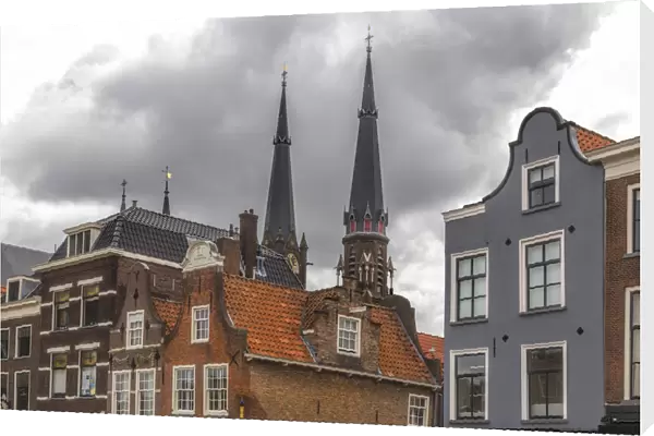 Gabled houses in Delft under a dramatic sky