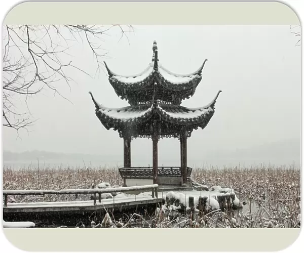 Scenic view of a pavilion by the West Lake in snow, Hangzhou, China