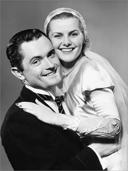 Young smiling couple, (B&W), portrait