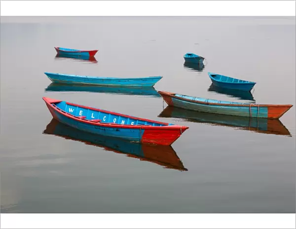 Welcome. Wooden boats on Phewa lake in Pokhara, Nepal