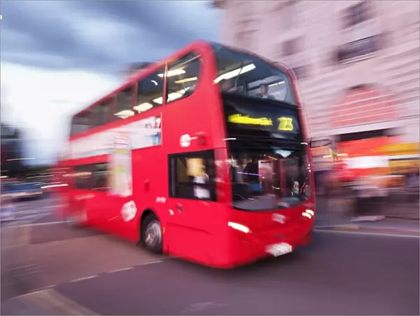 Red double decker bus, motion blur, Piccadilly Circus, London, England, United Kingdom