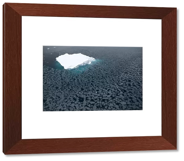 Iceberg surrounded by slush, Paradise Bay, Antarctic Peninsula, Antarctica