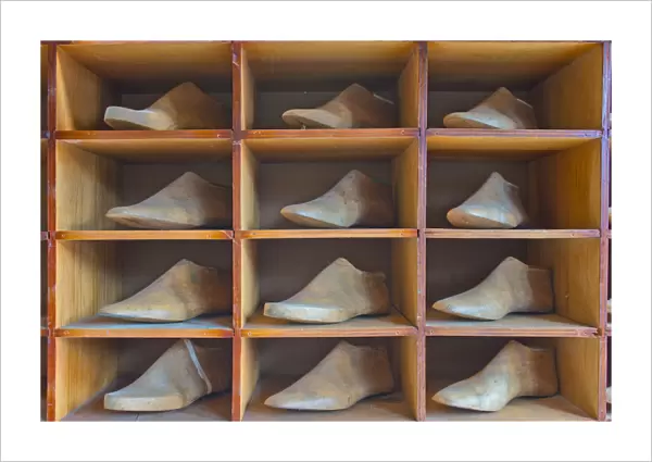 Shelf with antique lasts for manufacturing shoes