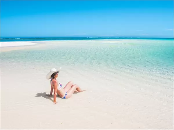 Woman relaxing on the beach. Turquoise Bay, Western Australia