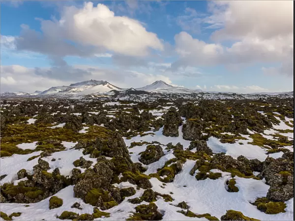 Lava rocks with the snowy mountain, Iceland