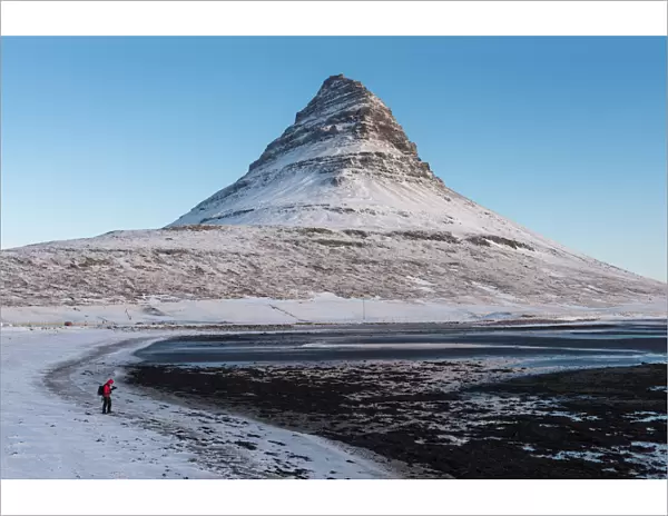 A photographer and Mt. Kirkjufell, Iceland
