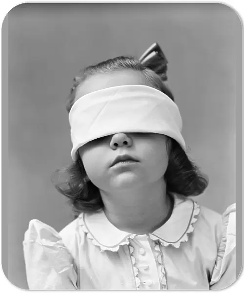 Girl wearing blindfold, playing game