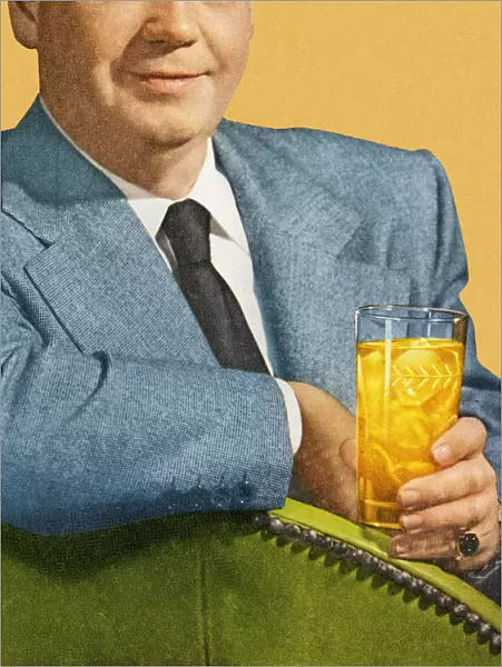Man Sitting and Holding Drink