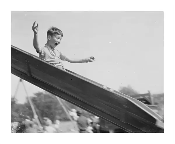 A young boy on a slide in Dartford, Kent. 1939
